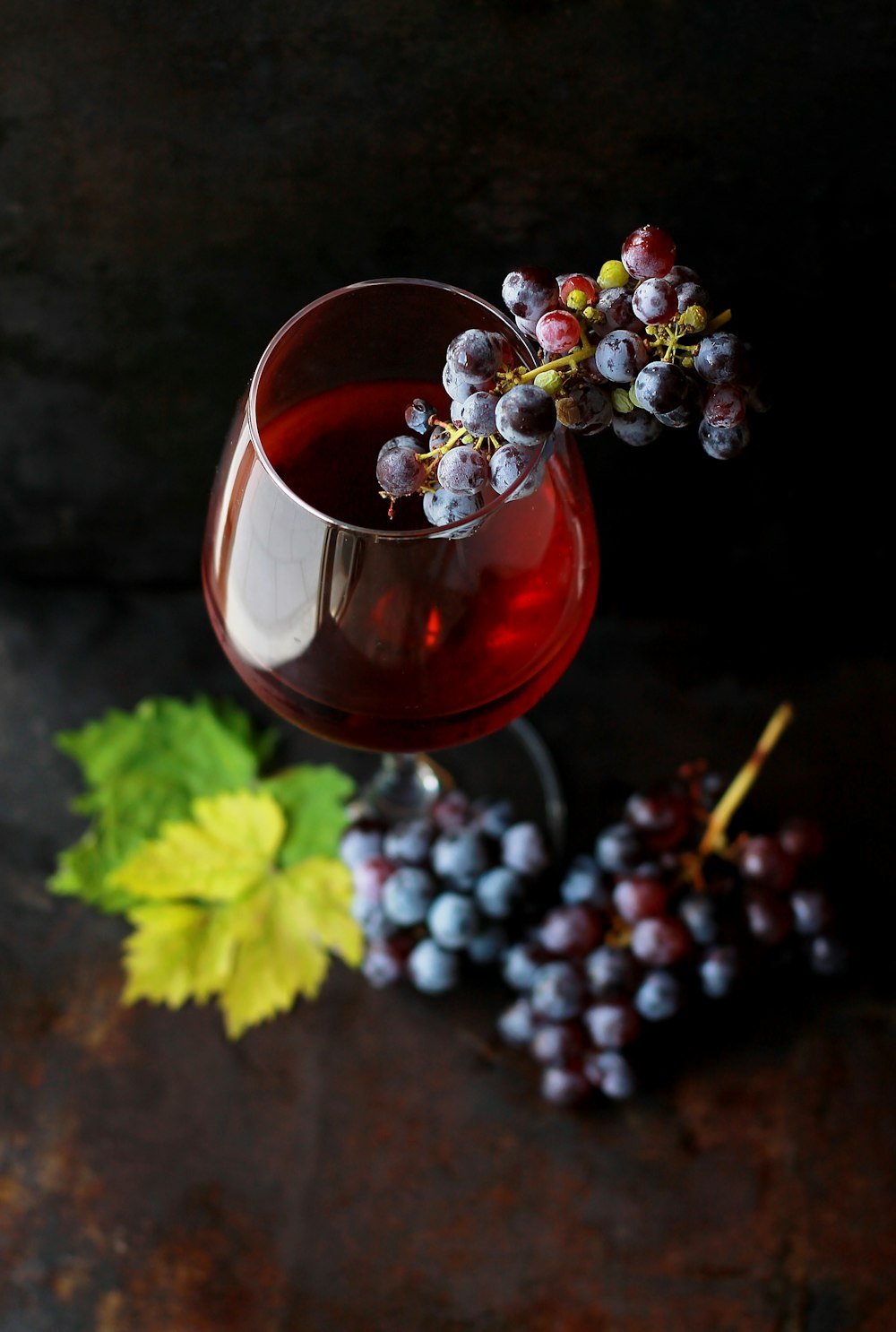 Glass of wine with grapes